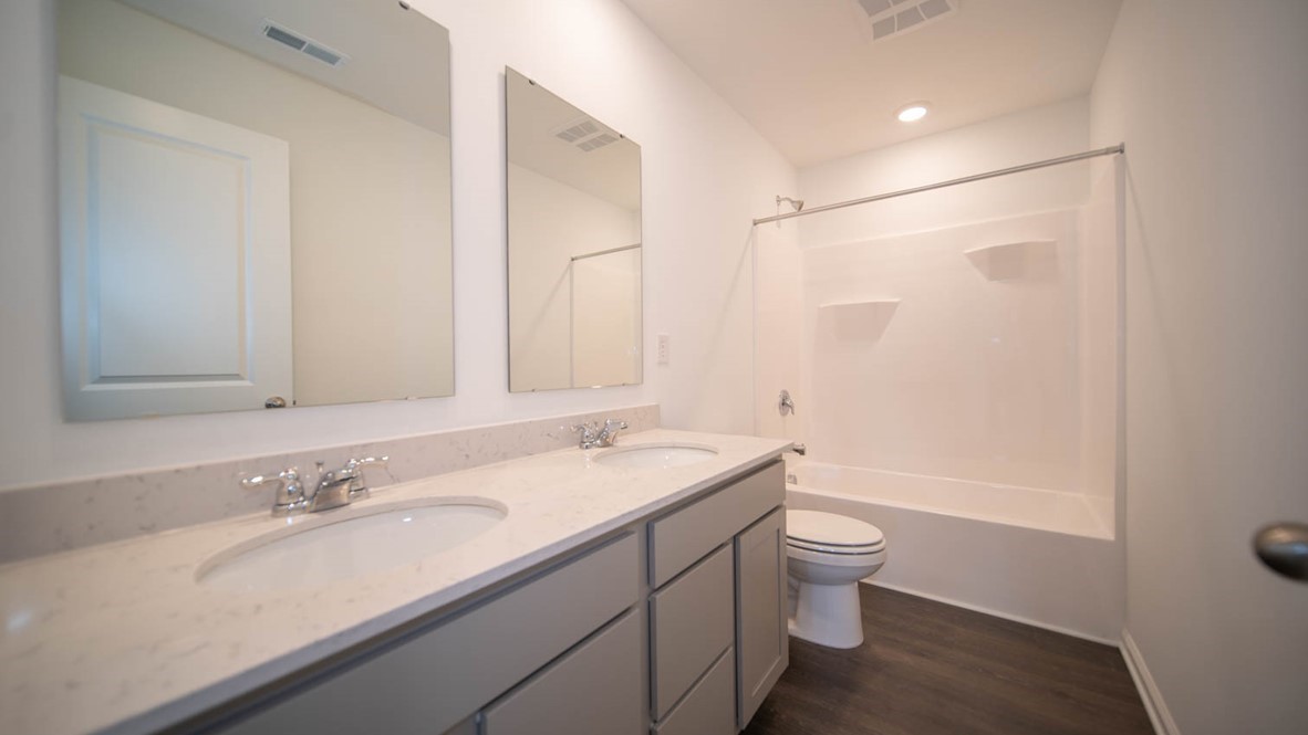 bathroom with dual vanity