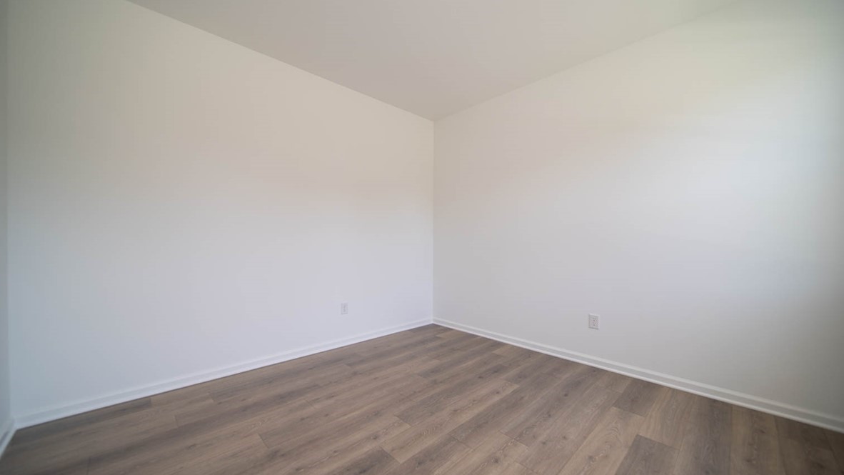 The den room with vinyl wood flooring.
