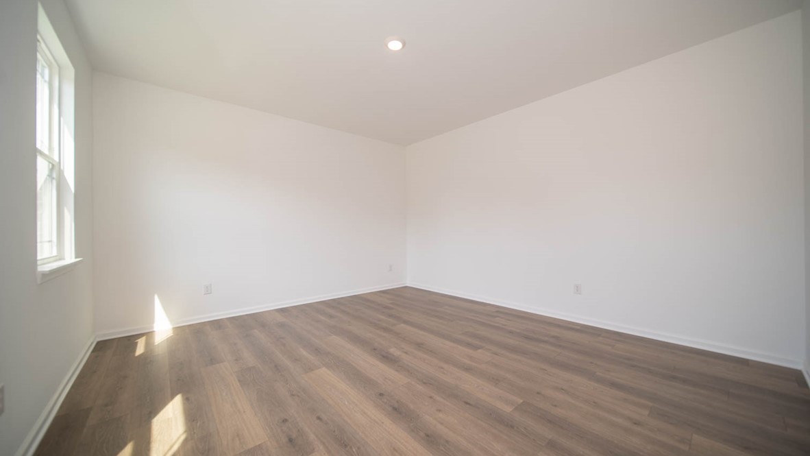 Living room area with vinyl wood flooring.