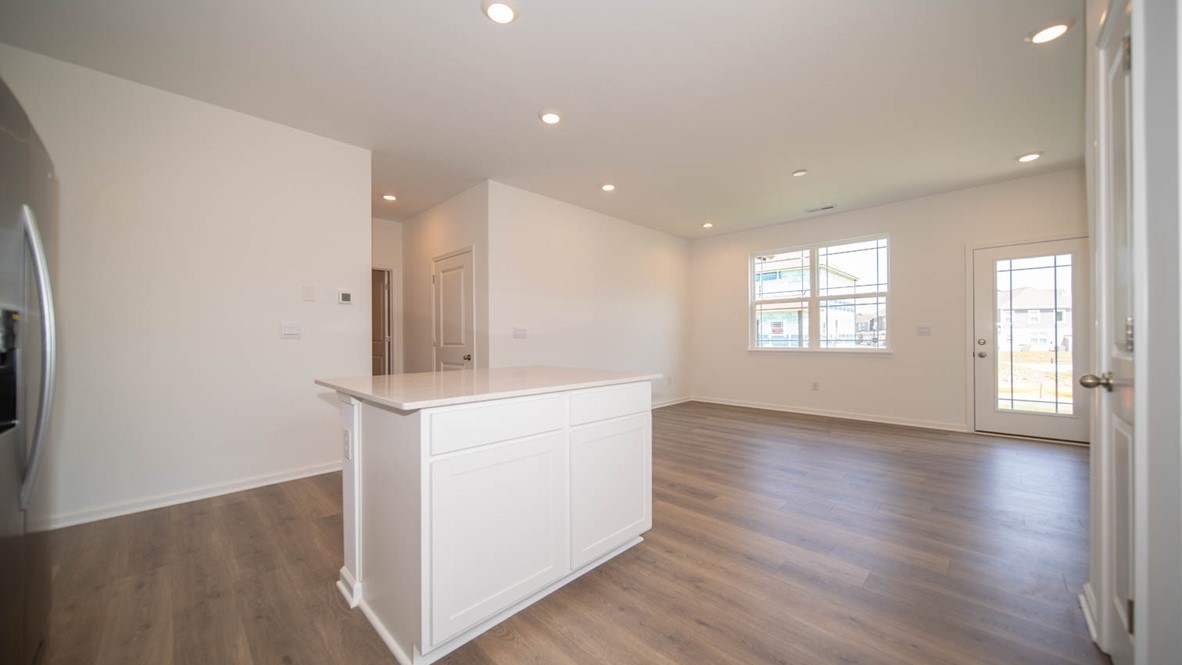 Open-concept kitchen beside great room.