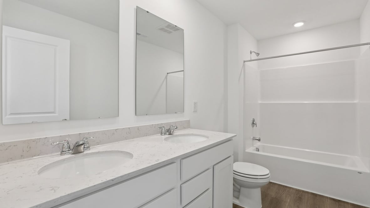 bathroom with dual vanity
