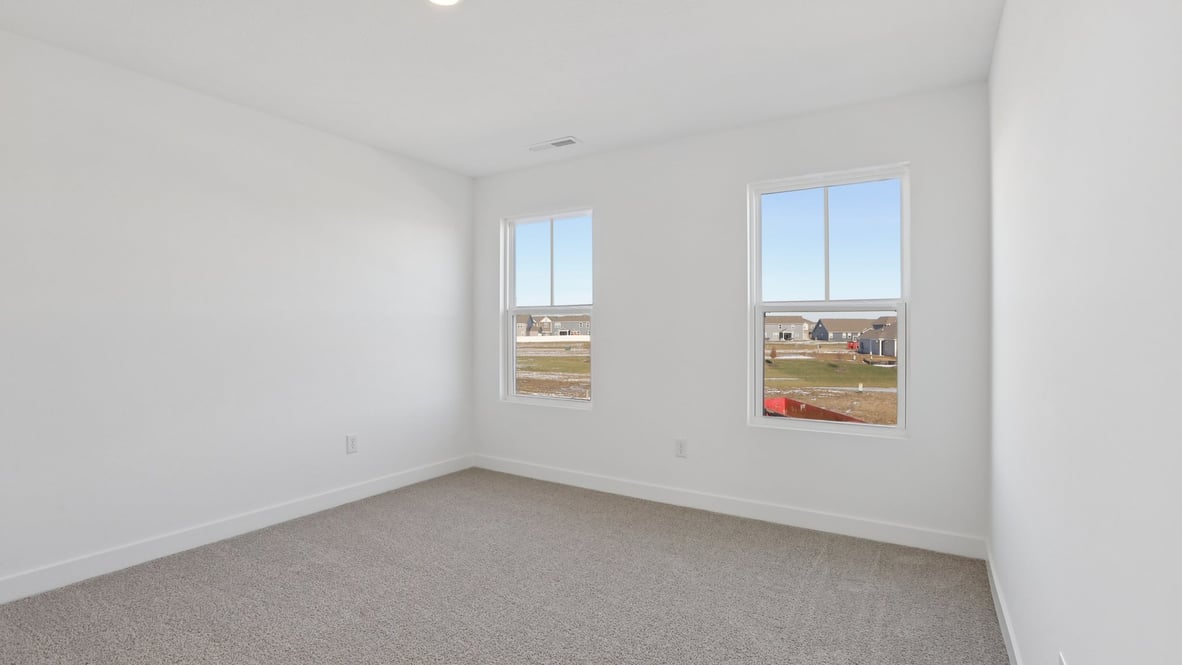 primary bedroom with large windows