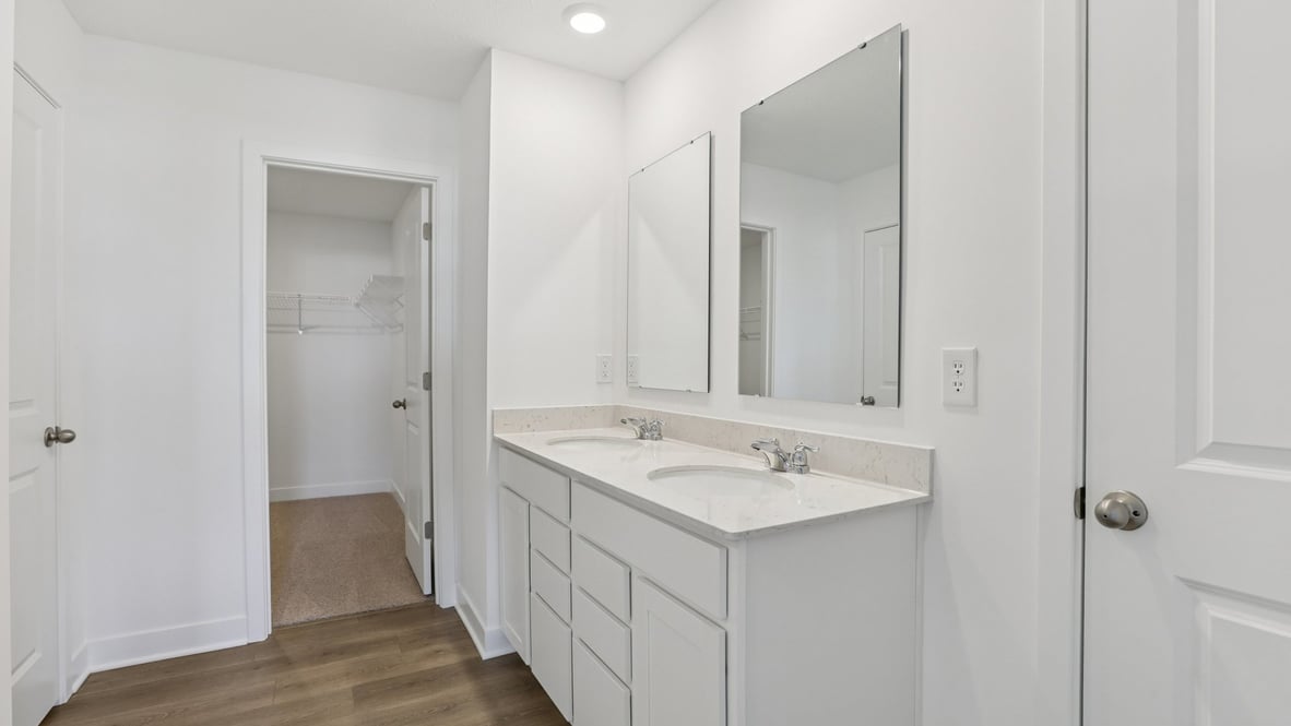 primary bathroom with dual vanity