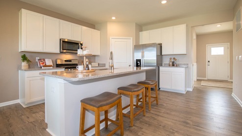 kitchen with white cabinets and island