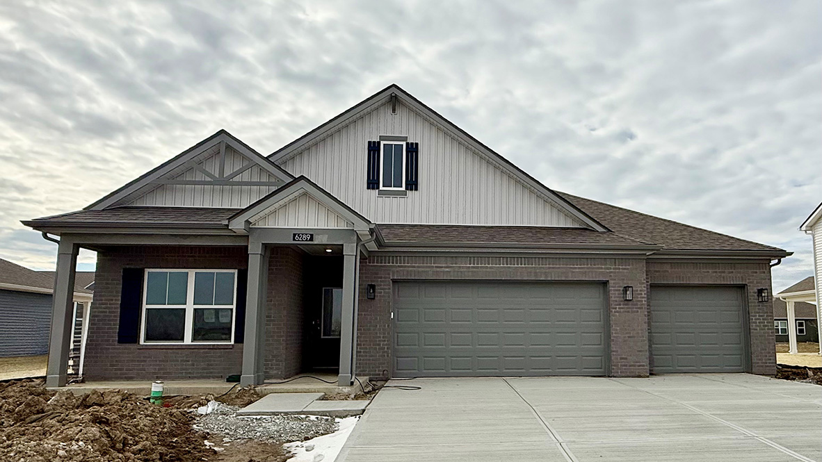 one-story home with 3-car garage in trailside