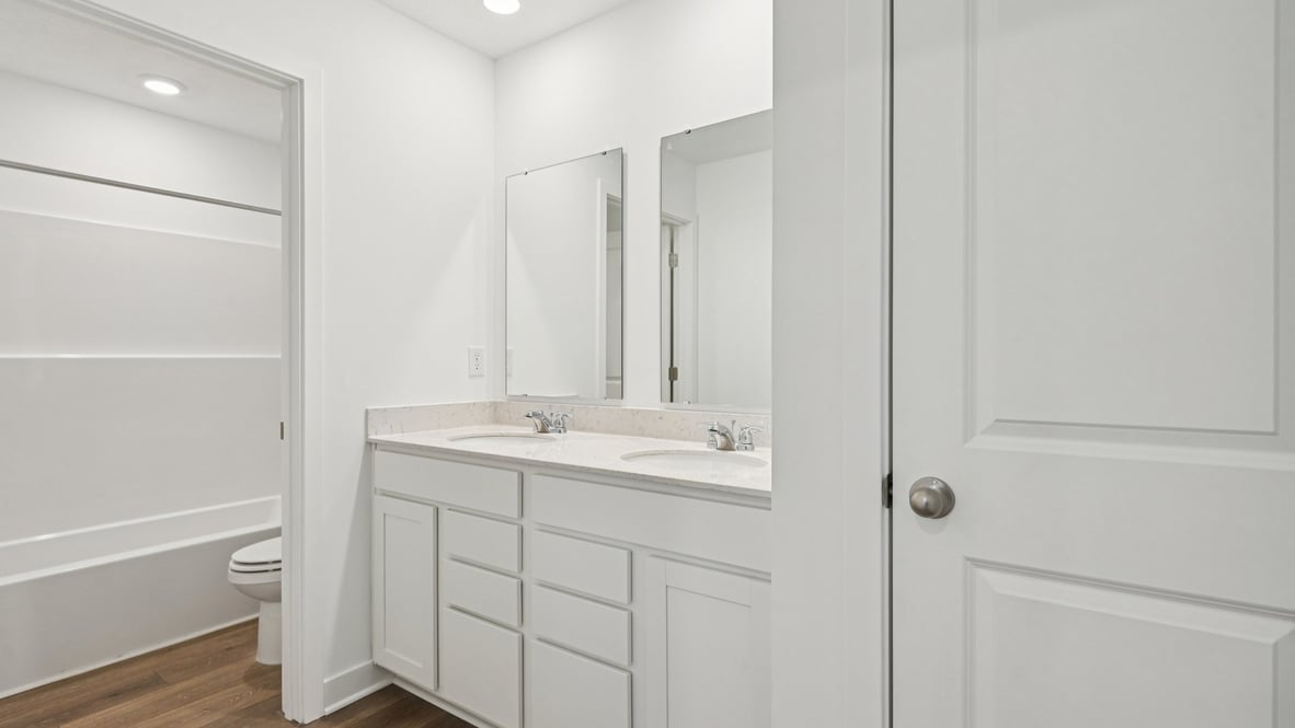 bathroom with dual vanity