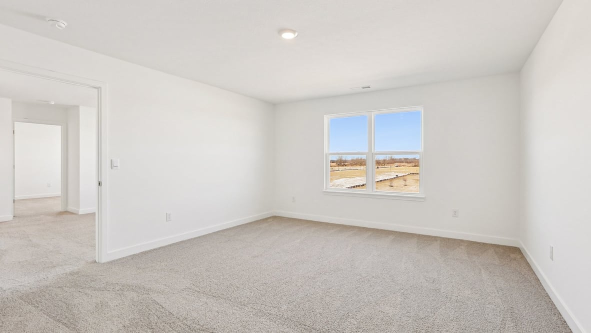 primary bedroom with large windows