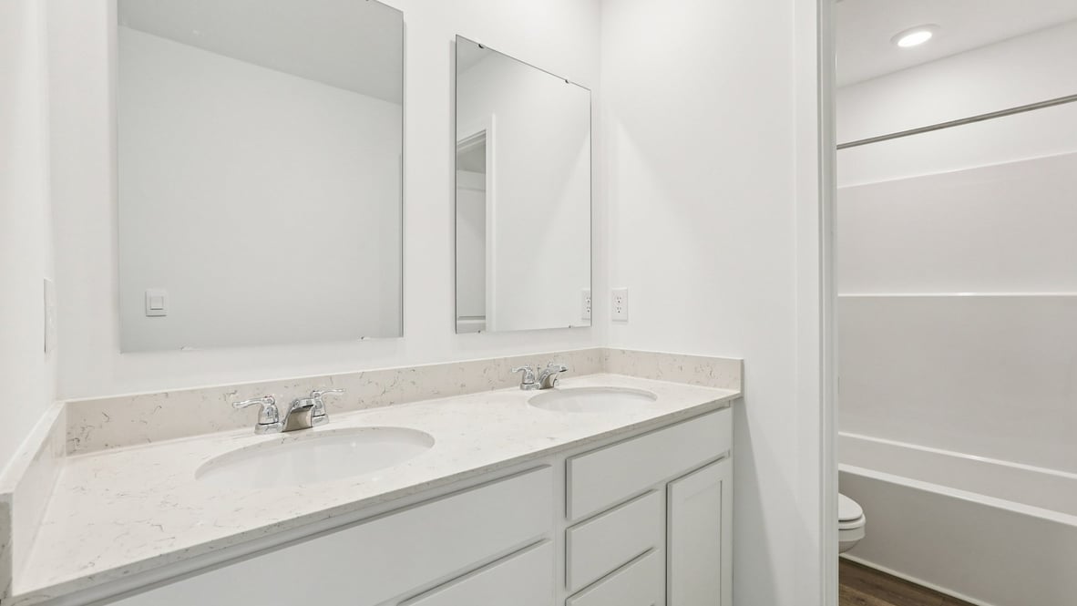 bathroom with dual vanity