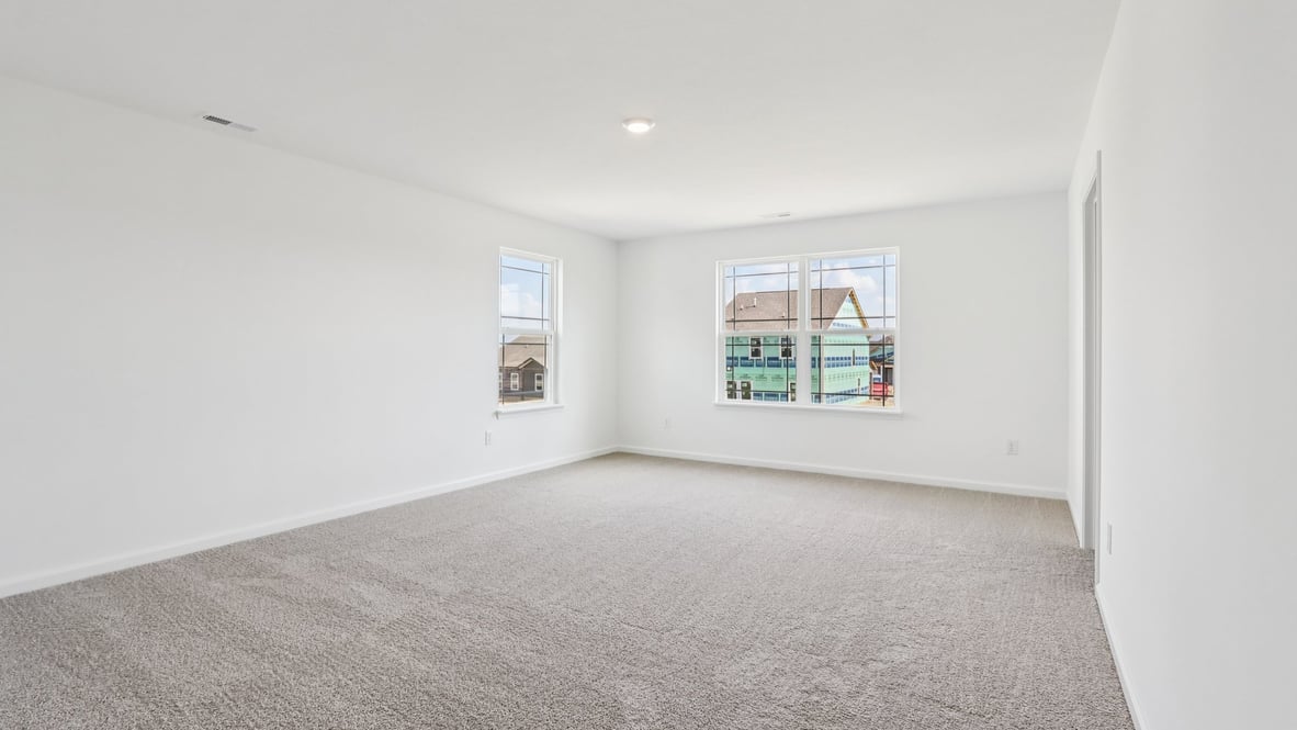primary bedroom with large windows
