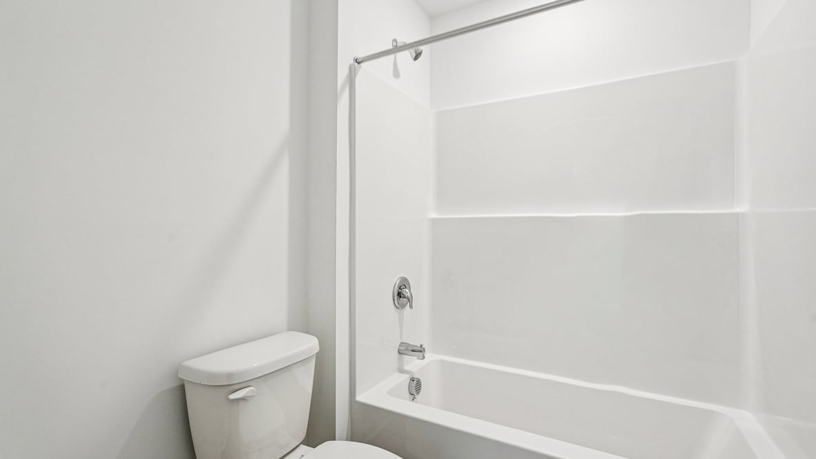 bathroom with shower and tub