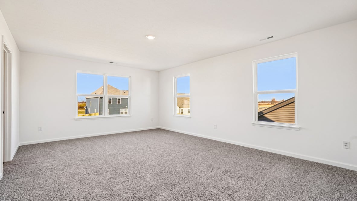 primary bedroom with large windows