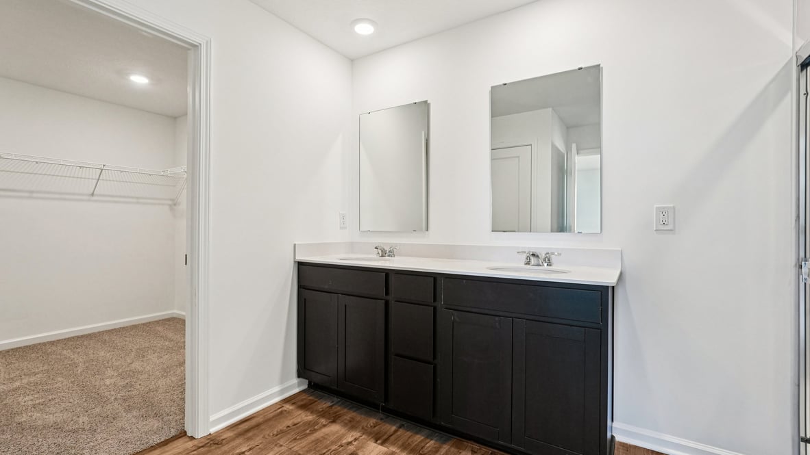 primary bathroom with dual vanity