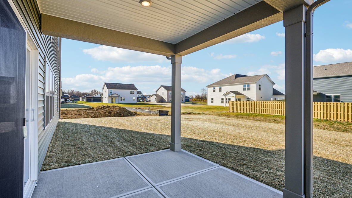 covered patio on the back of the home