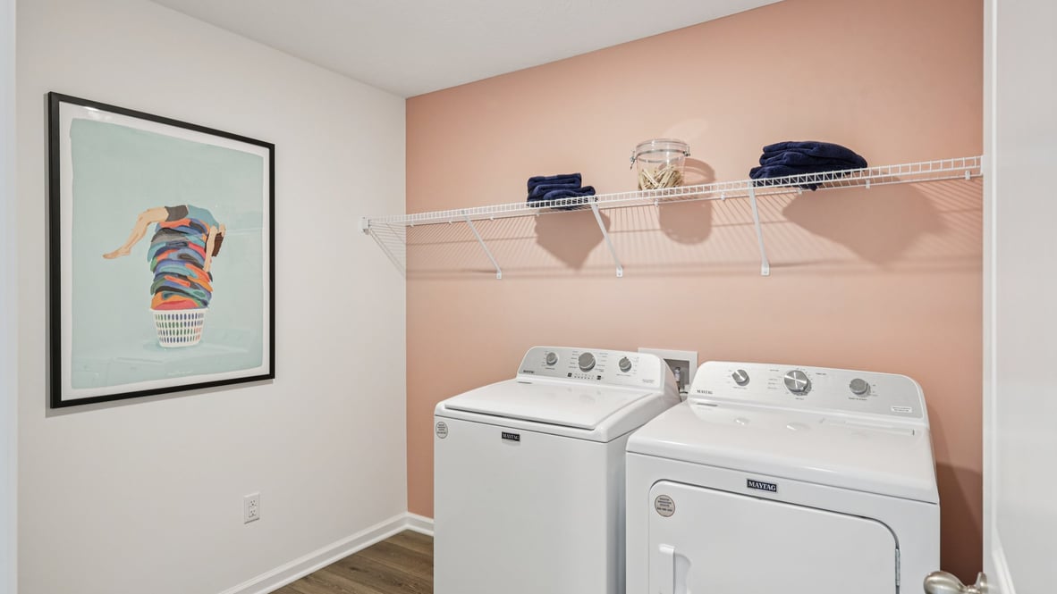 Interior laundry room with accent wall