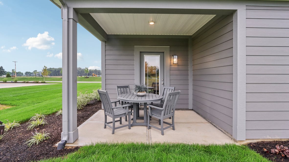 covered patio on the back of the home