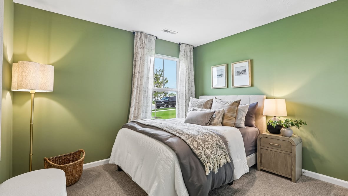 bedroom with window in the corner