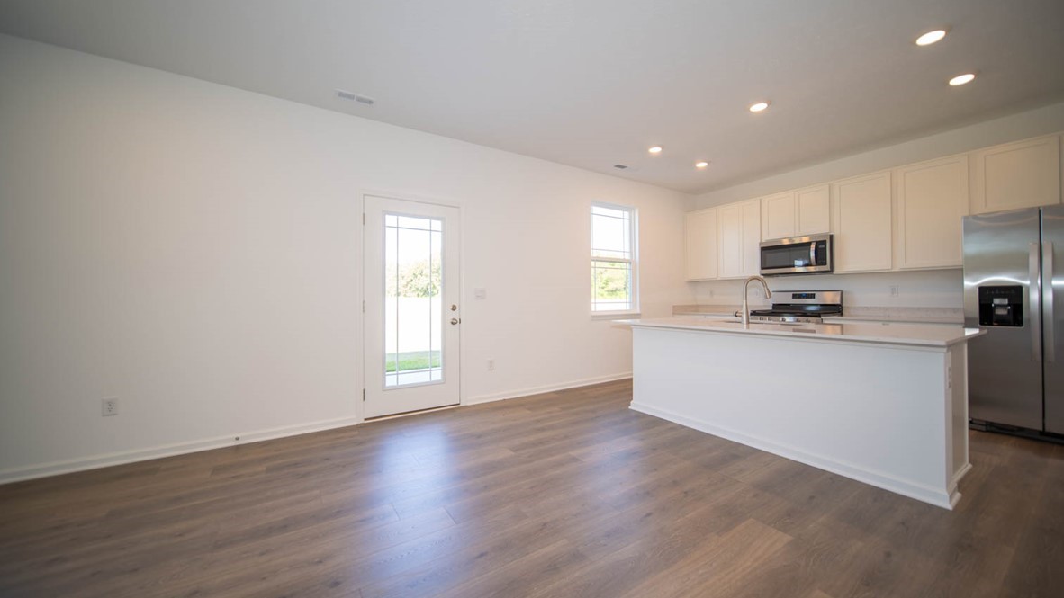 island overlooking great room and dining