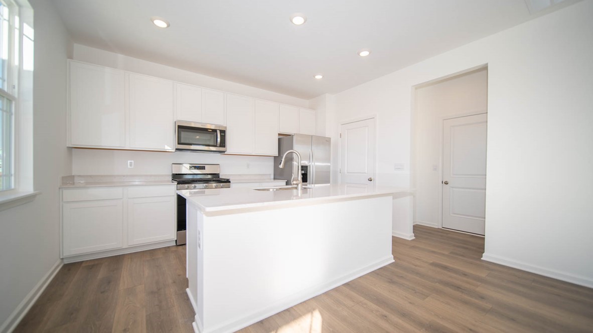 kitchen with white cabinets and quartz countertops