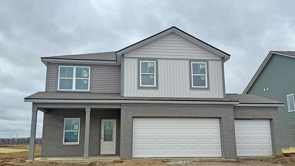 two-story home with 3-car garage in trailside