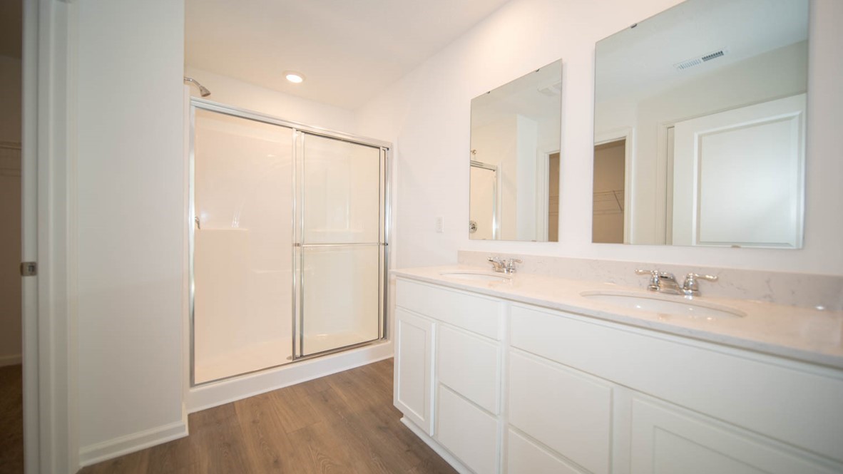 primary bathroom with dual sinks
