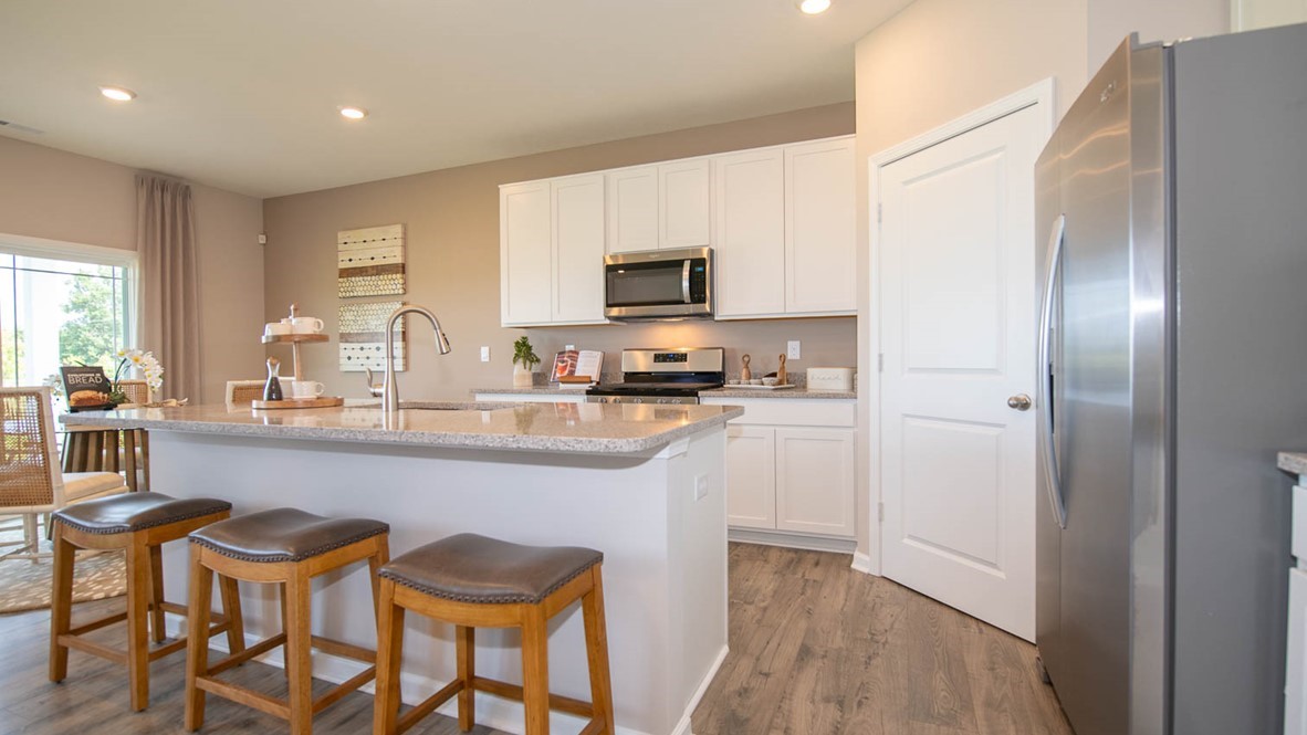 The kitchen has stainless appliances