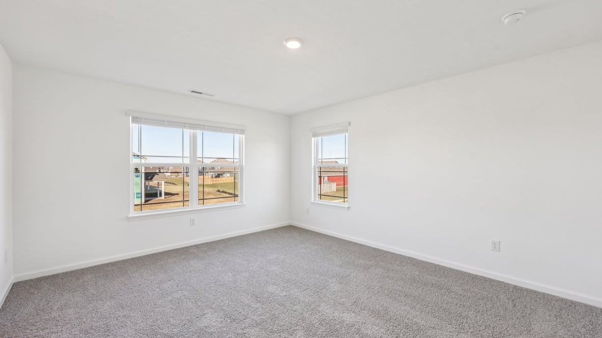 primary bedroom with large windows