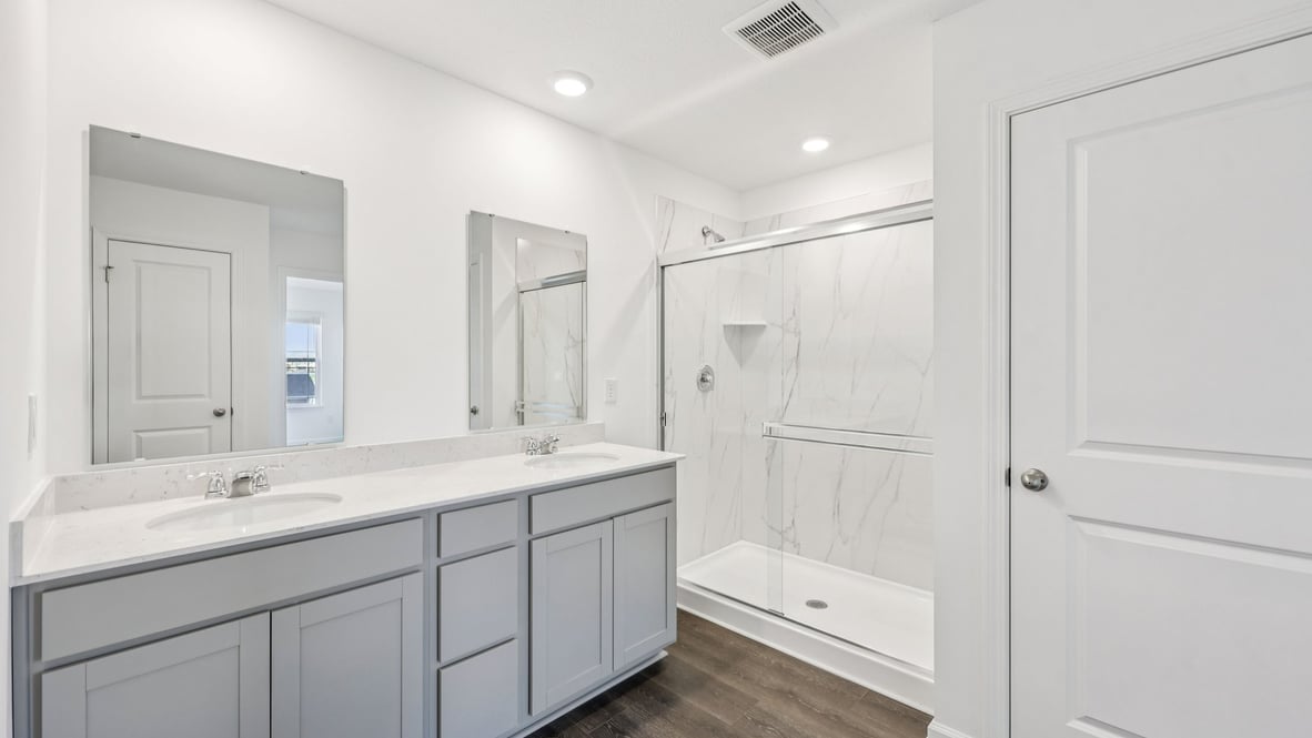 primary bathroom with dual vanity