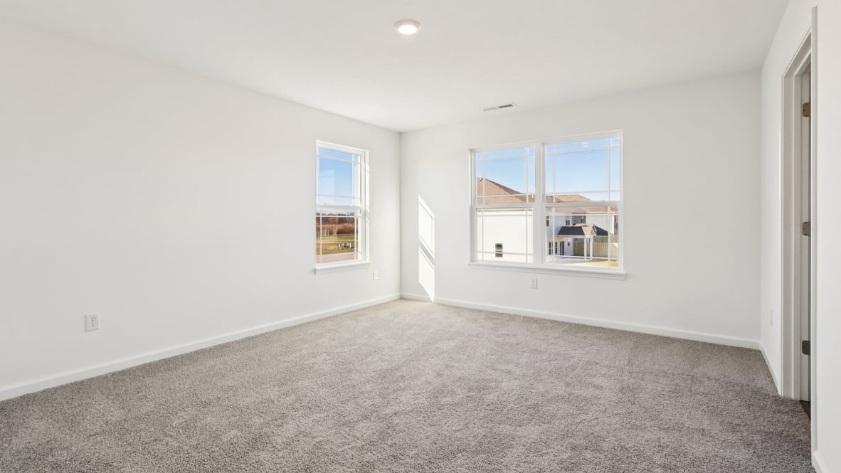 primary bedroom with large windows