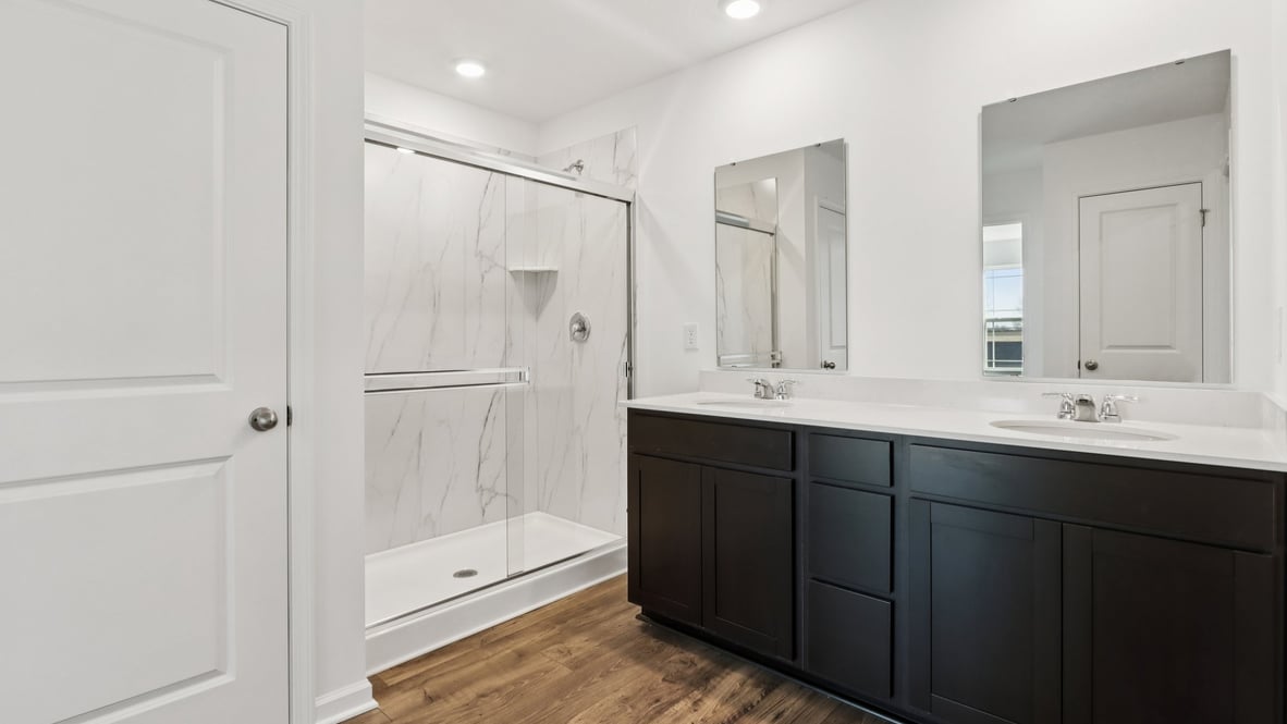 primary bathroom with dual vanity