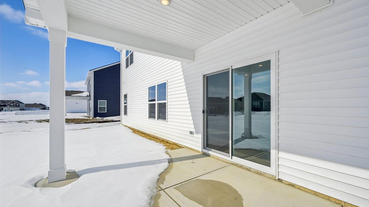 covered patio on the back of the home
