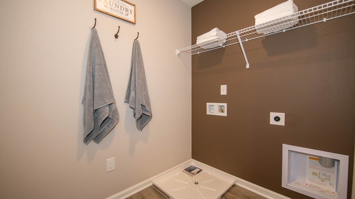 Upper Level laundry room located near the main bedroom