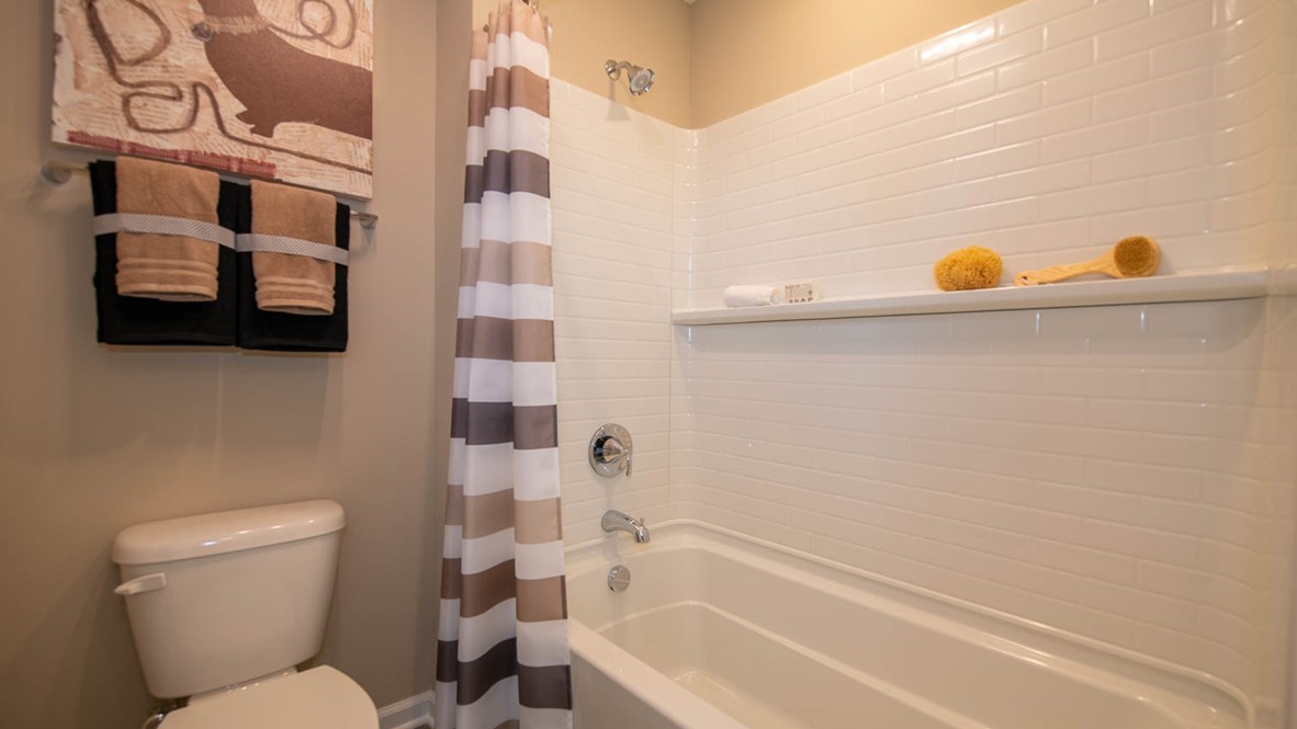 A lovely Hall bath is easily accessible to the loft and second and third bedrooms