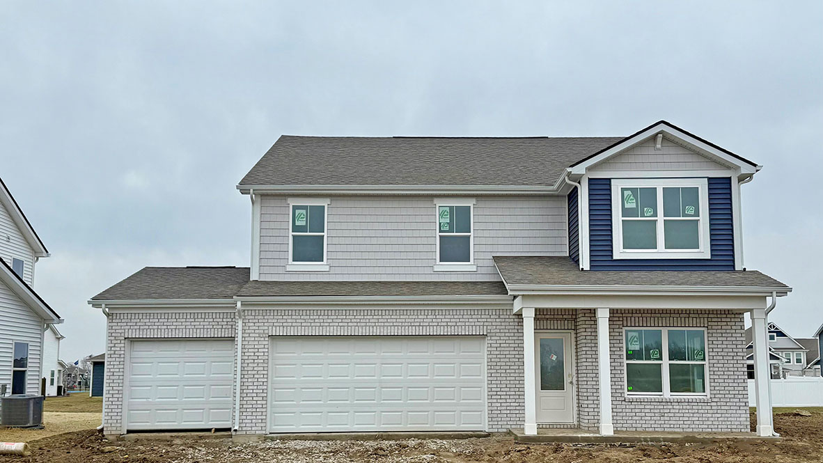 two-story home with 3-car garage in trailside