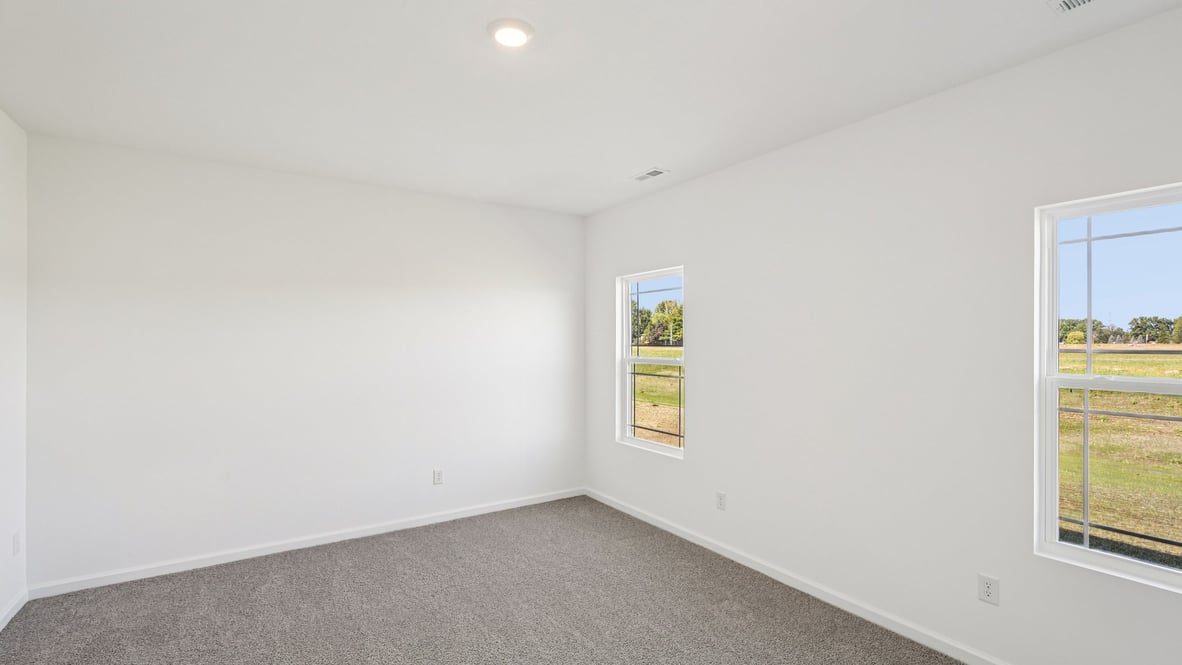 Primary bedroom designed with privacy and comfort in mind, flowing into the spa-inspired ensuite and walk-in closet Parkview Village