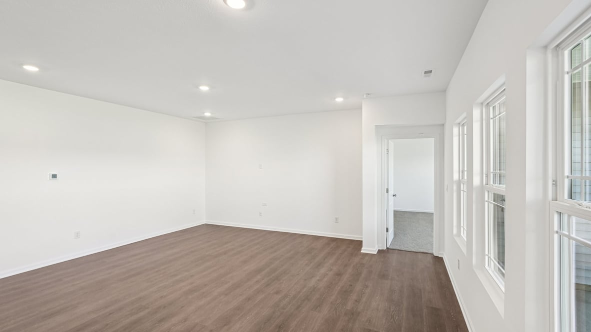 Living room perspective highlighting the entrance to the primary bedroom Parkview Village