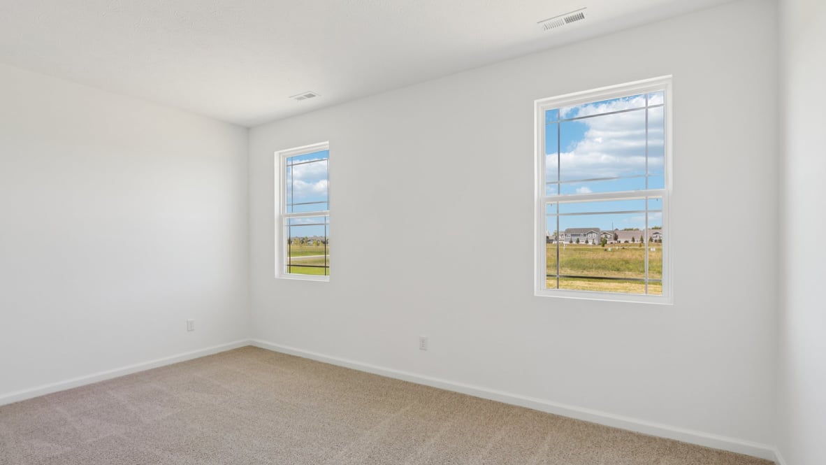 primary bedroom with windows