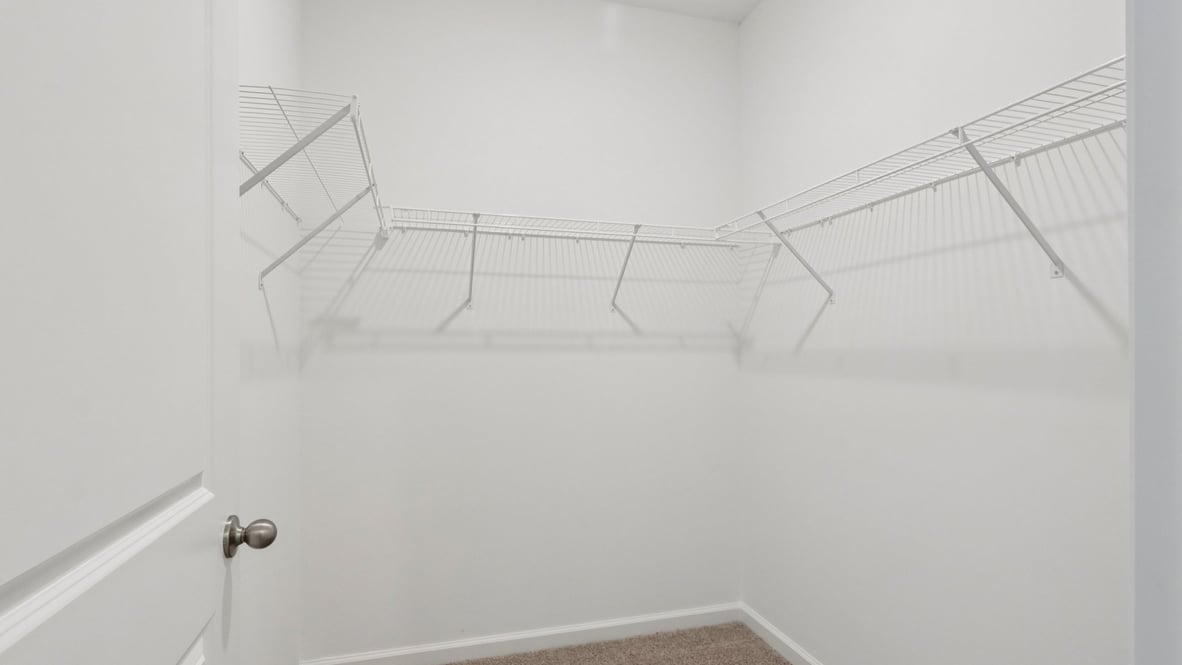 primary closet with shelving