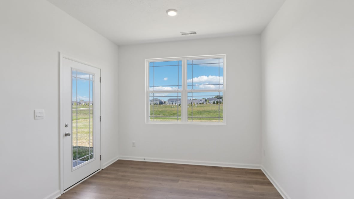 dining nook with door to outdoor patio