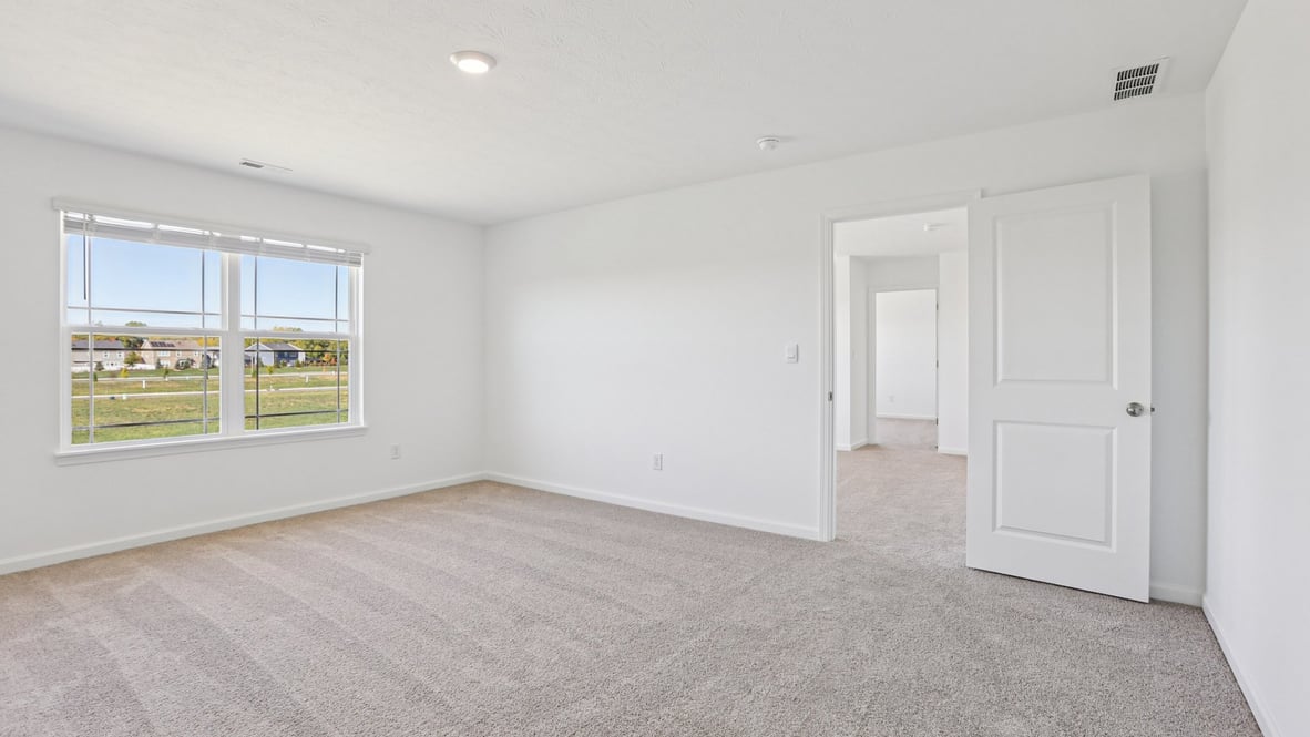 primary bedroom with large windows
