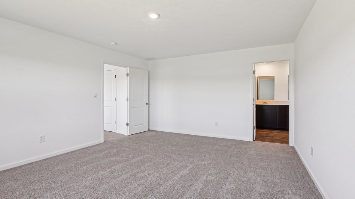primary bedroom with ensuite bathroom