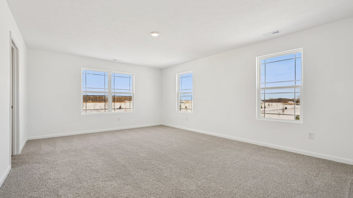 primary bedroom with large windows