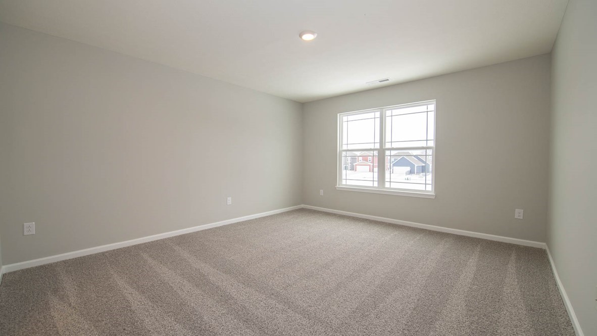 primary bedroom with large windows