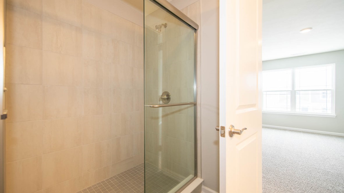primary bathroom with walk-in shower