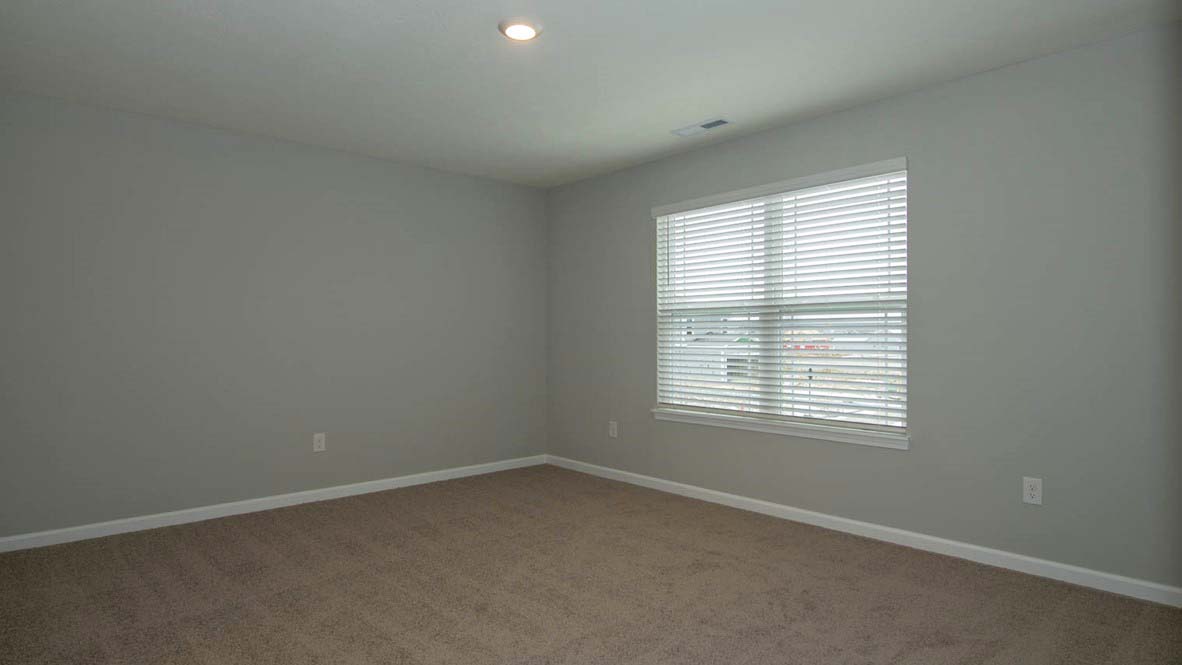 primary bedroom with windows
