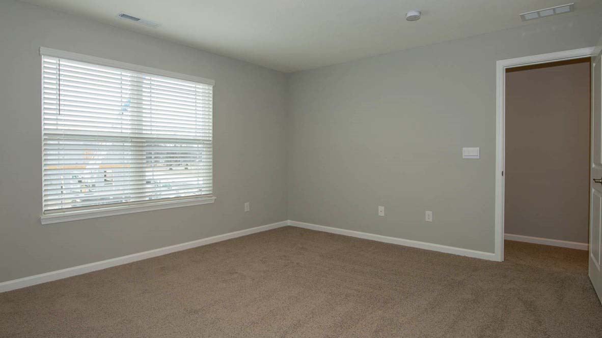 primary bedroom with windows