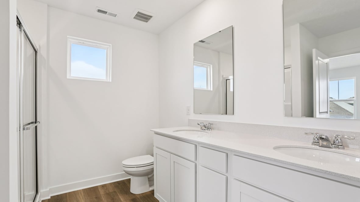 primary bathroom with dual vanity