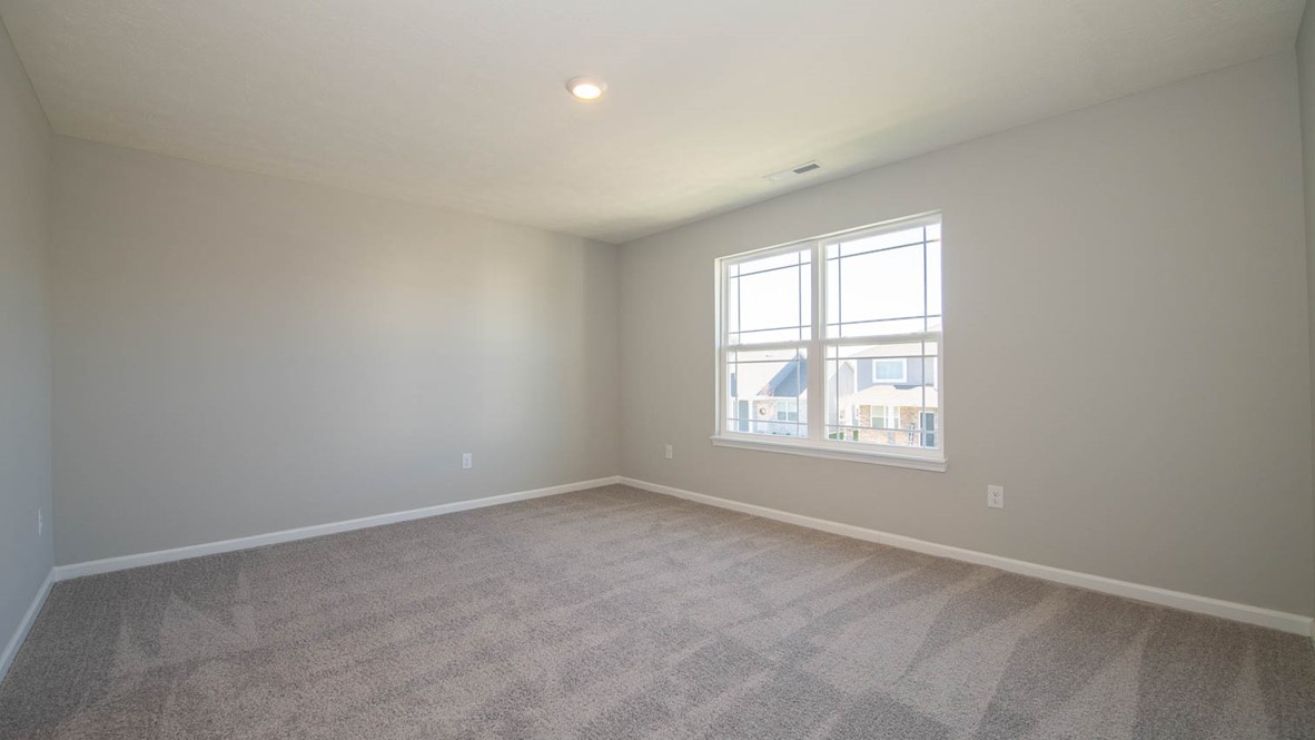 primary bedroom with large windows
