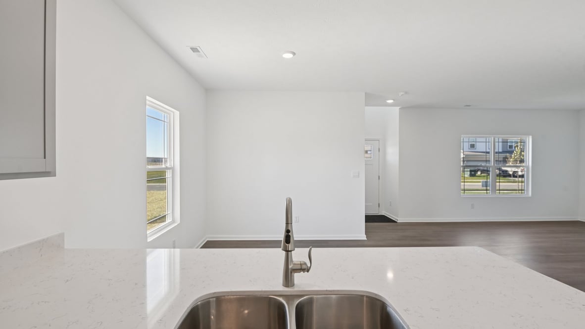 open concept kitchen dining and living area