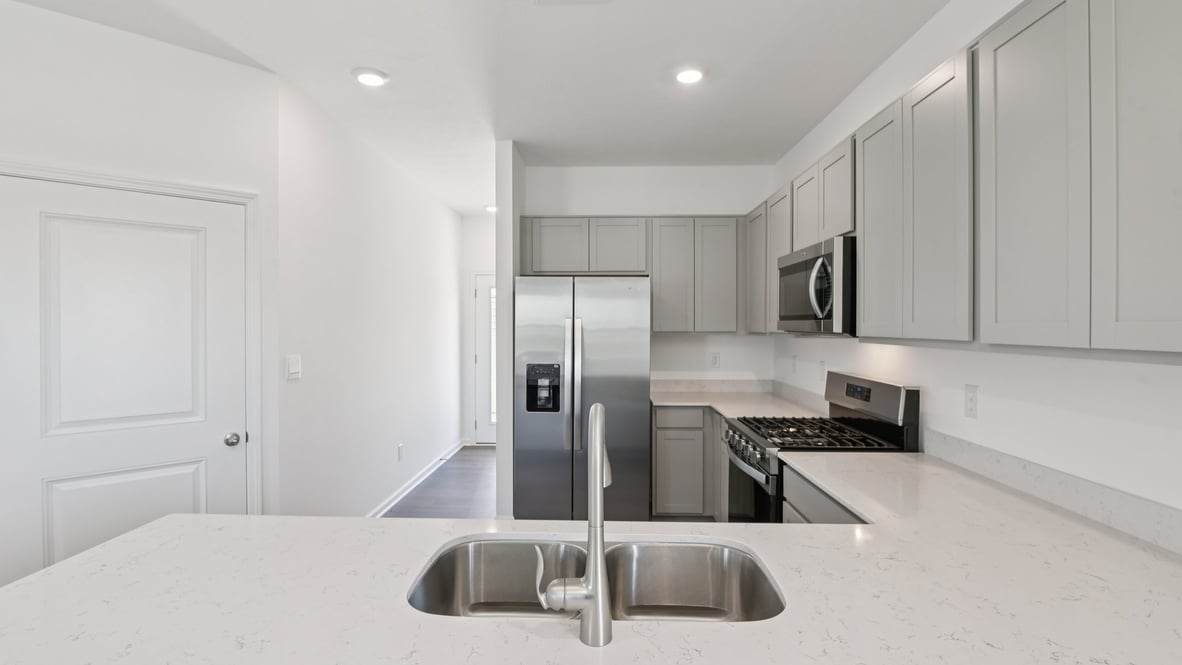 kitchen with quartz countertops and stainless steel appliances