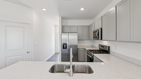 kitchen with quartz countertops and stainless steel appliances